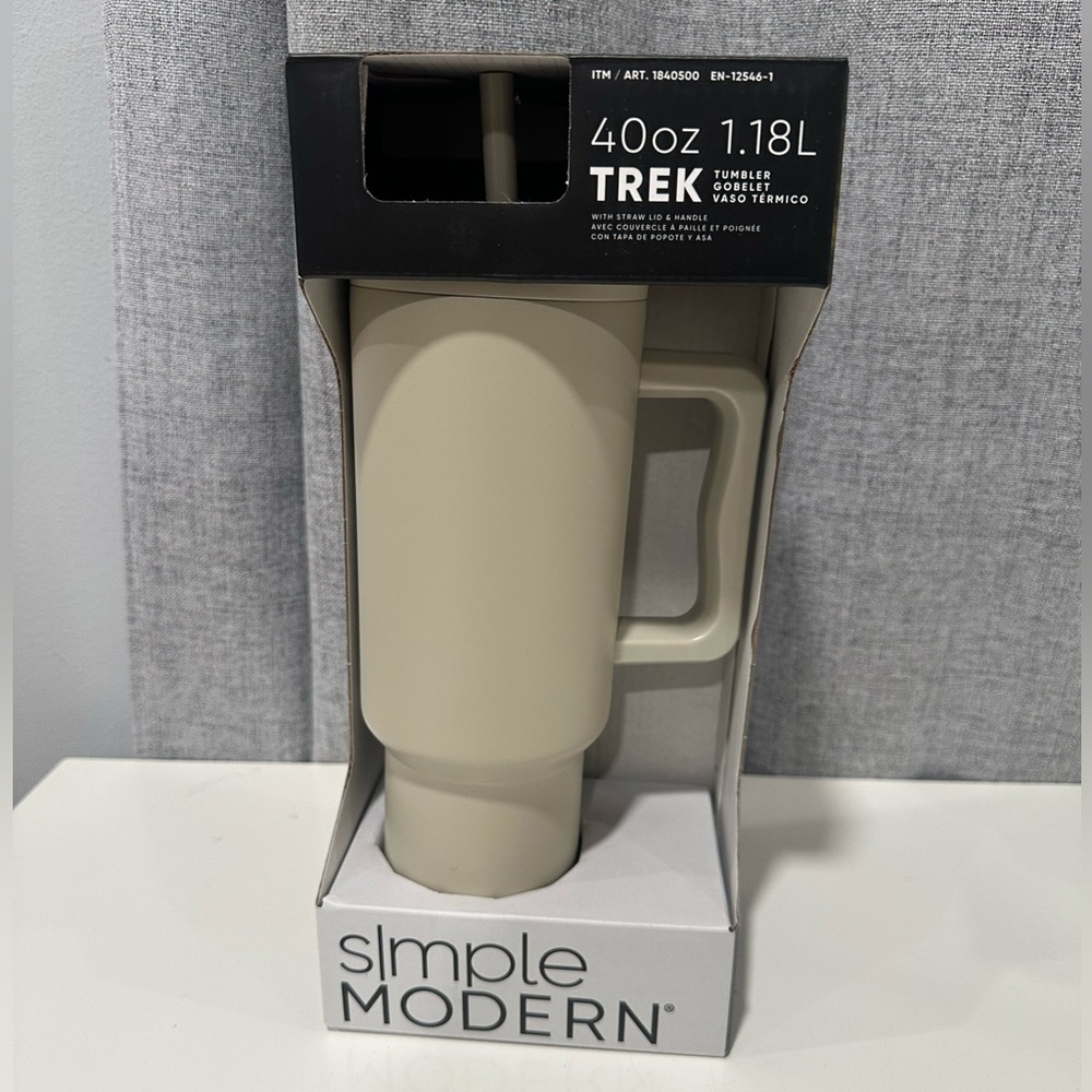 Simple modern 40 fl oz. beige insulated stainless steel track Tumblr with straw.